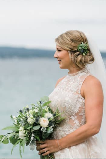 A side profile of bride with bouquet